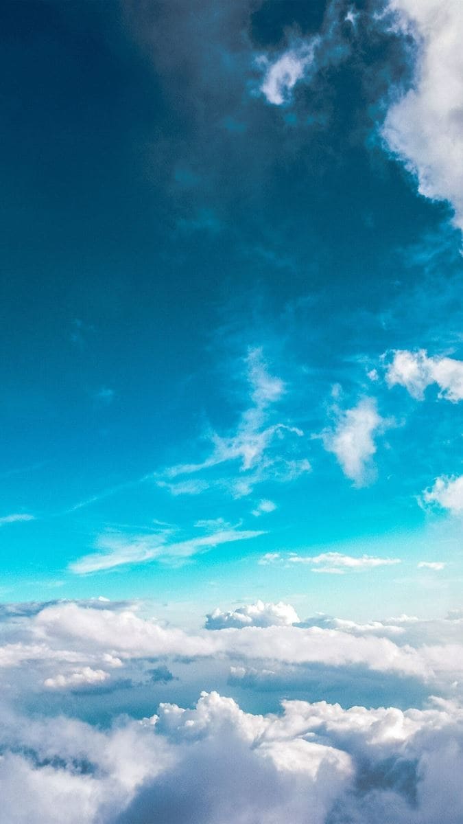 Hình ảnh những áng mây bồng bềnh tạo thành cảnh hùng vĩ trên bầu trời làm hình nền điện thoại